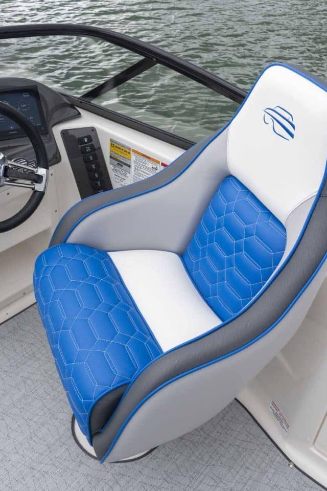 Overhead photo showing one of Splendor Boats' customized deck boat's interior with a blue and white captain's chair.