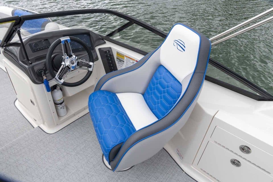 Overhead photo showing one of Splendor Boats' customized deck boat's interior with a blue and white captain's chair.